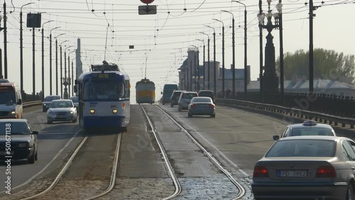 Busy traffic and trams on the Stone Bridge in Riga. photo