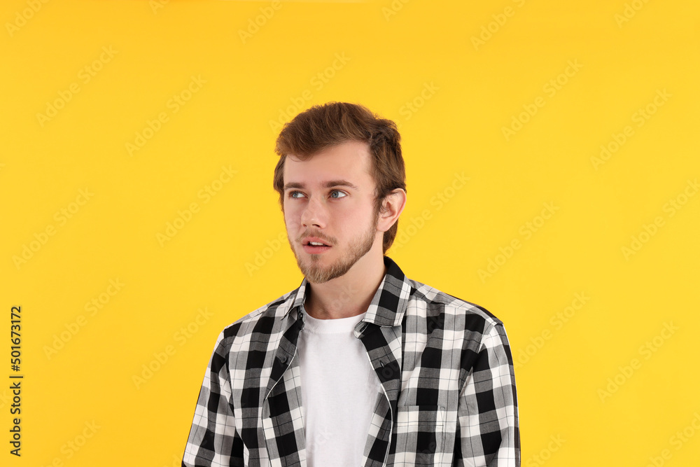 Concept of people with young man on yellow background Concept of people with young man on yellow background