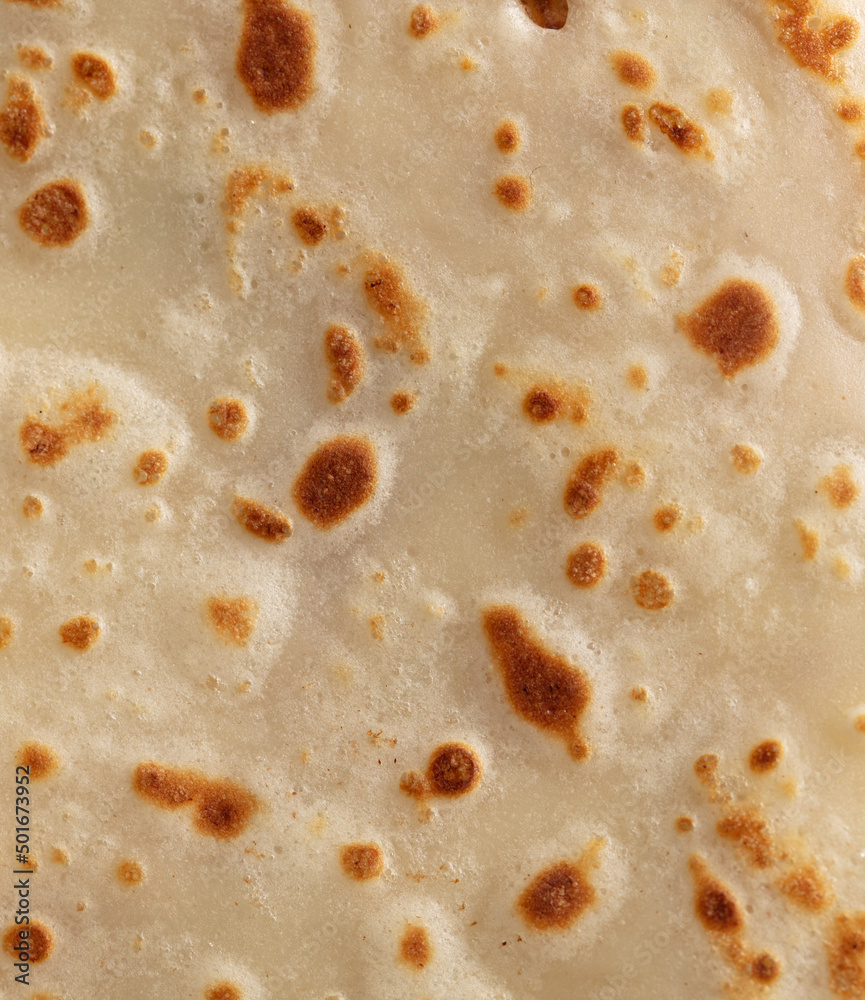 Pan fried pancake as a background.