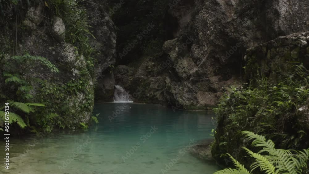 Dolly in shot of a grotto and a waterfall in the Balneario Mata de Maiz. Dolly in shot of a grotto and a waterfall in the Balneario Mata de Maiz.