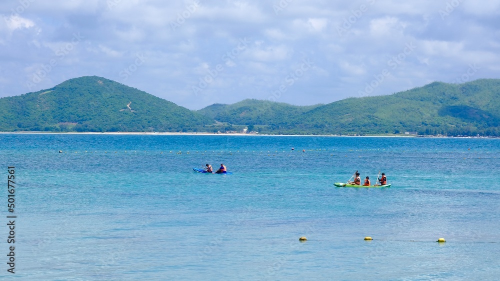 People kayaking in the beautiful sea. Activities on the water, sport and recreation.