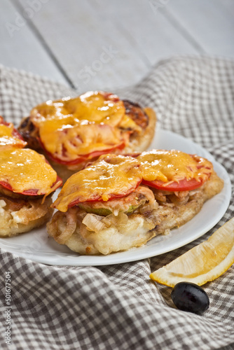 Fried chicken with tomatoes and cheese, Ukrainian cuisine. Photo of food on a white background