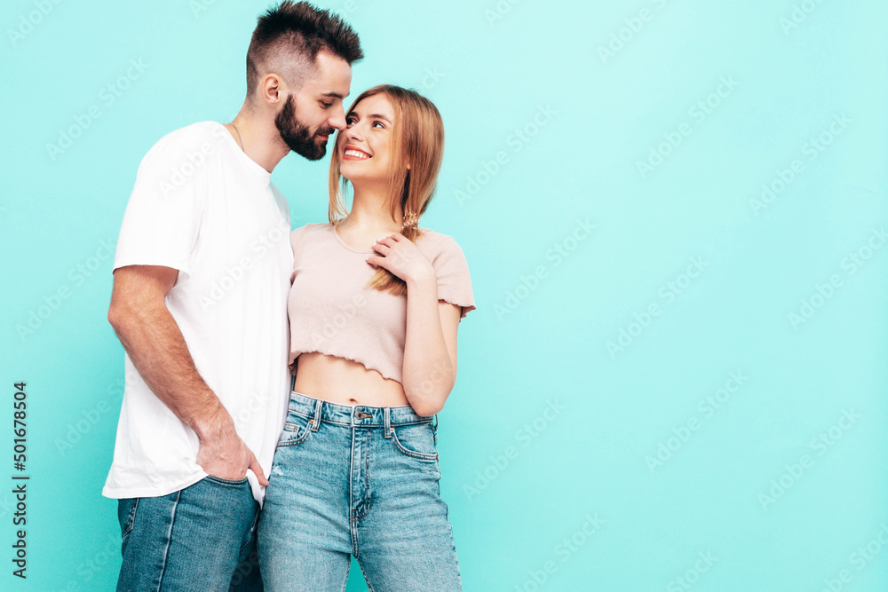 Sexy smiling beautiful woman and her handsome boyfriend. Happy cheerful family having tender moments near blue wall in studio.Pure cheerful models hugging.Embracing each other. Cheerful and happy Sexy smiling beautiful woman and her handsome boyfriend. Happy cheerful family having tender moments near blue wall in studio.Pure cheerful models hugging.Embracing each other. Cheerful and happy