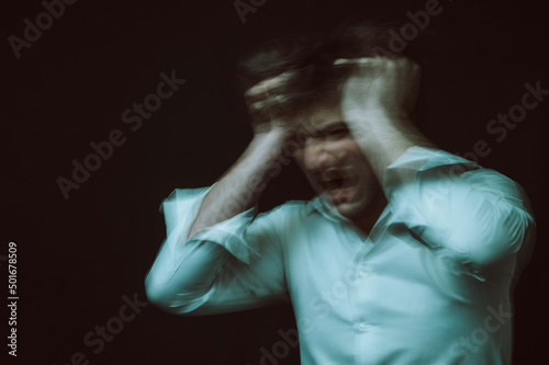 schizophrenic abstract blurry portrait of man with mental disorders and mental illnesses on dark background