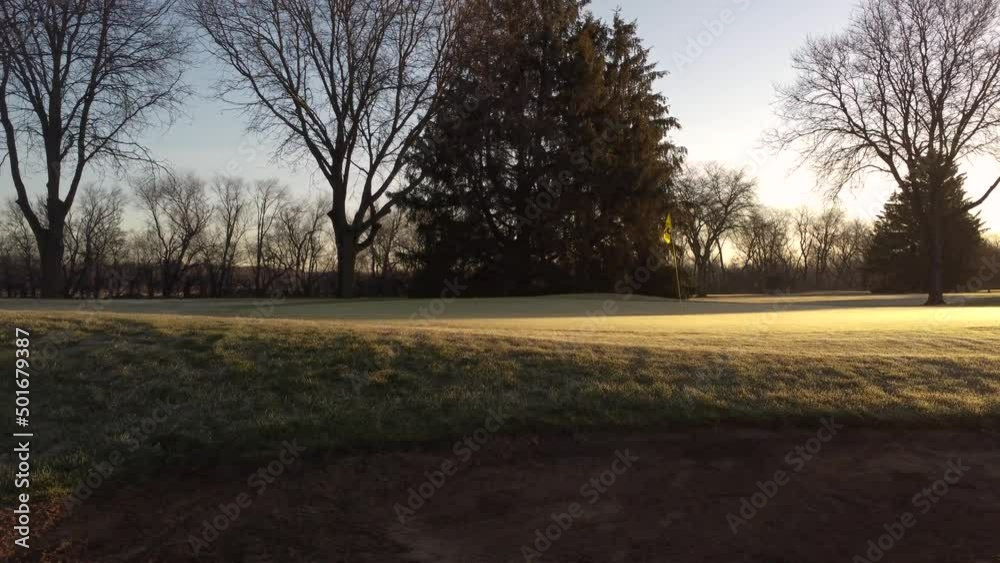 Golf Course Bunker In The Morning With Golden Sun Shining At Calm Sunrise. Golf Course Bunker In The Morning With Golden Sun Shining At Calm Sunrise.