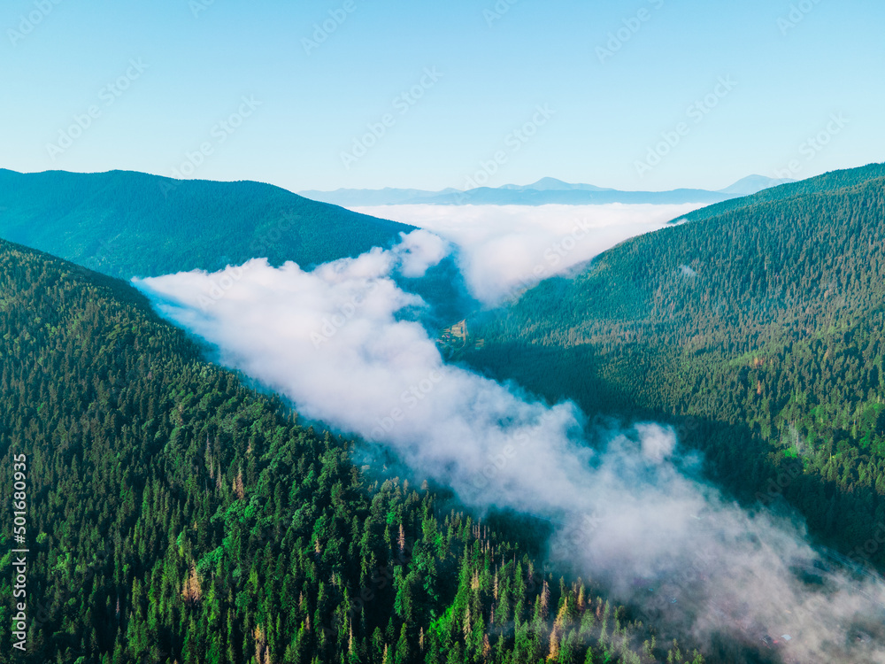 aerial view of carpathian mountains range white clouds