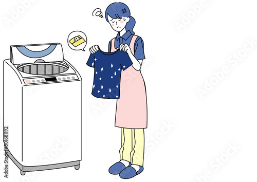 ティッシュを一緒に洗濯してしまい困る女性