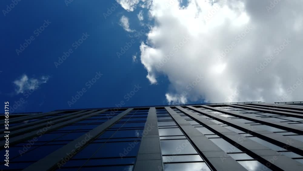 Exterior of a high-rise apartment building facade, windows and balconies. Exterior of a high-rise apartment building facade, windows and balconies.