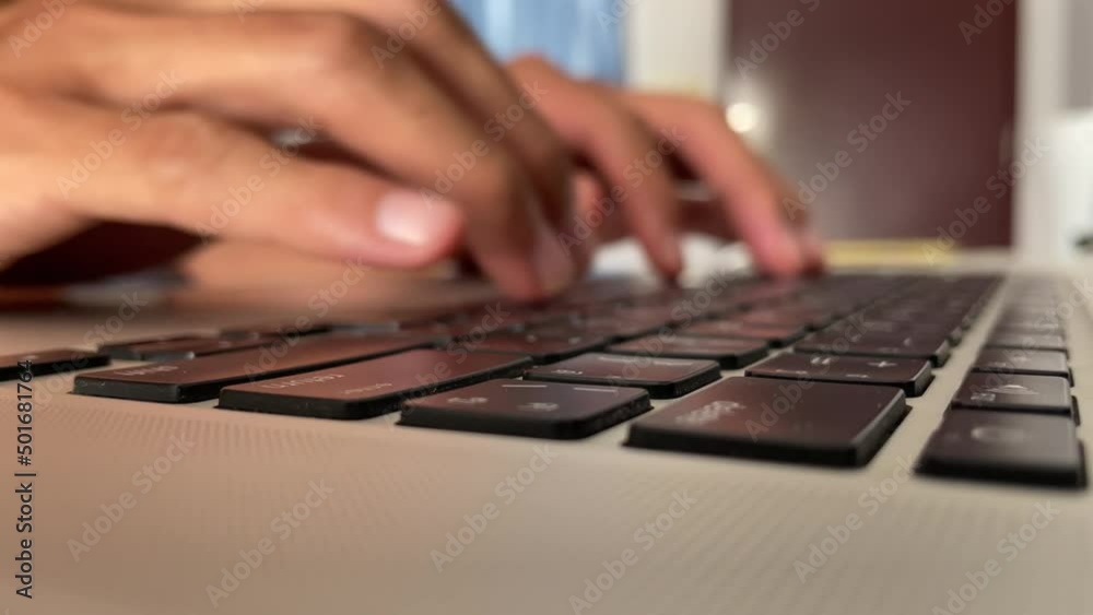 Typing on keyboard. Male hand fingers pressing button key on English - Thai laptop keyboard. Work from home professional hand typing close up shot - technology concept Typing on keyboard. Male hand fingers pressing button key on English - Thai laptop keyboard. Work from home professional hand typing close up shot - technology concept