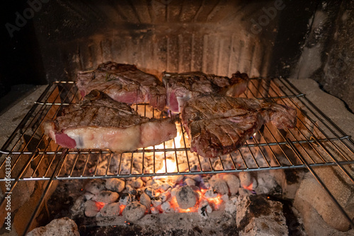 Barbecue Italian Fiorentina steak on the grill photo