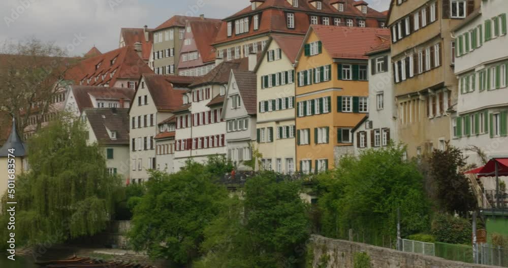 Tubingen historic medieval downtown river view in afternoon, Germany, Europe, wide angle, panning shot Tubingen historic medieval downtown river view in afternoon, Germany, Europe, wide angle, panning shot