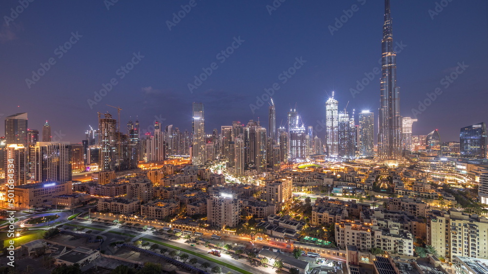 Fototapeta premium Dubai Downtown night to day timelapse with tallest skyscraper and other towers