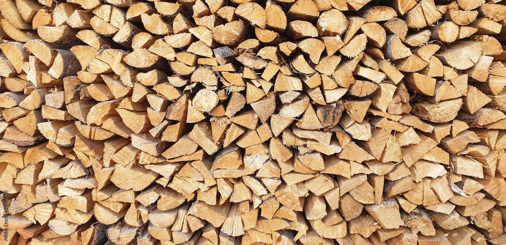 Background of stacked chopped firewood.