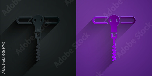Paper cut Wine corkscrew icon isolated on black on purple background. Paper art style. Vector