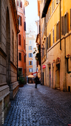 narrow yellow street in venice italy 