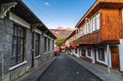 beautiful street with stone historical houses and paving stones against the backdrop of mountains in the resort of Gurzuf in the Crimea