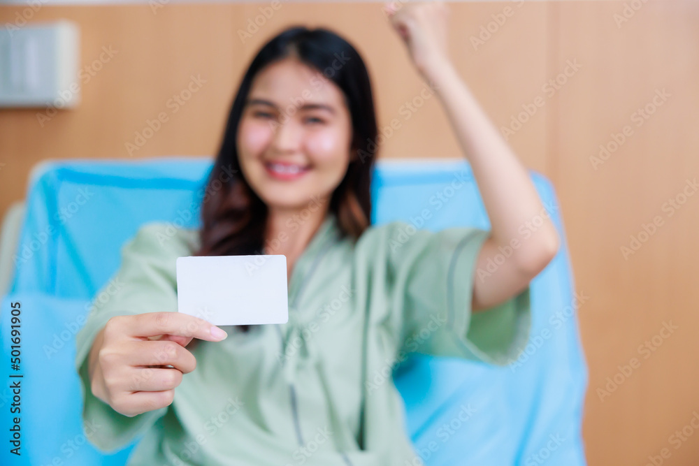 white card mockup in asian Beautiful woman patient hand sitting in hospital bed at medical center. white card mockup in asian Beautiful woman patient hand sitting in hospital bed at medical center.