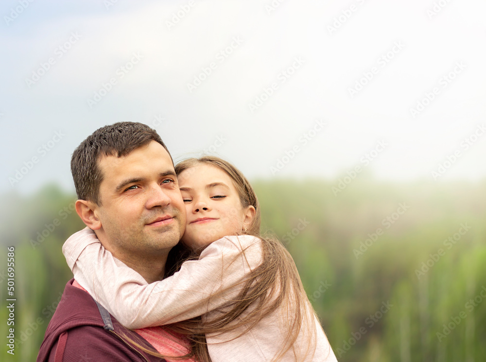 father and daughter hugging outdoors close-up father and daughter hugging outdoors close-up