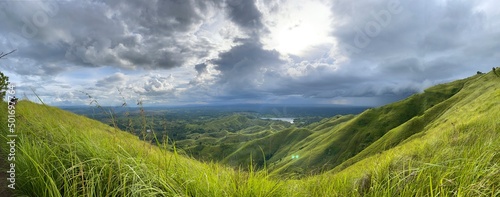 The Binabaje Hills of Brgy. Cambaol in Alica Municipality are featured in the Alicia Panoramic Park. The 400-meter-high hills are covered in tropical perennial grasses known as Cogon. photo