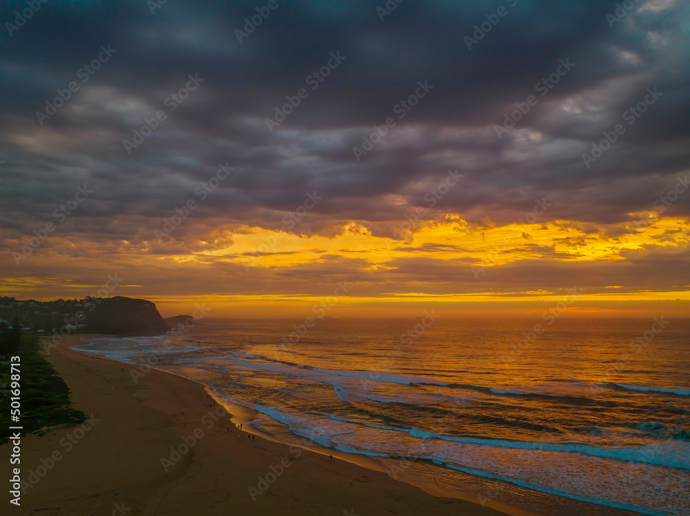 Sunrise reflections and clouds at the seaside with lagoon