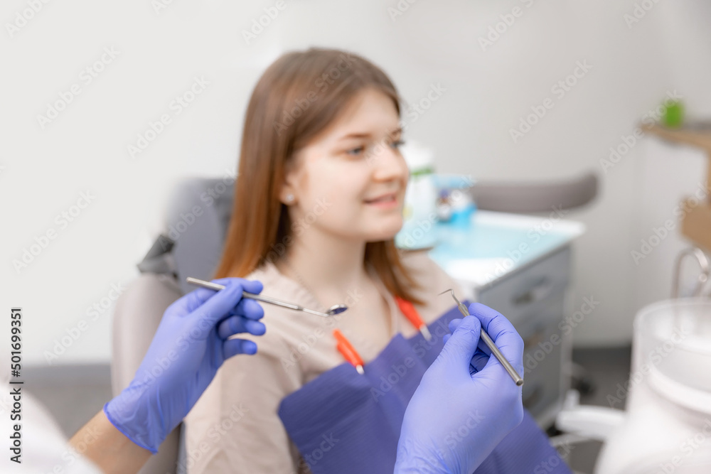 Happy young brunette woman at dentist checks her smile teeth Happy young brunette woman at dentist checks her smile teeth