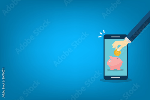 Donate, donation concept. Human hand with gold coin and piggy bank on mobile phone.