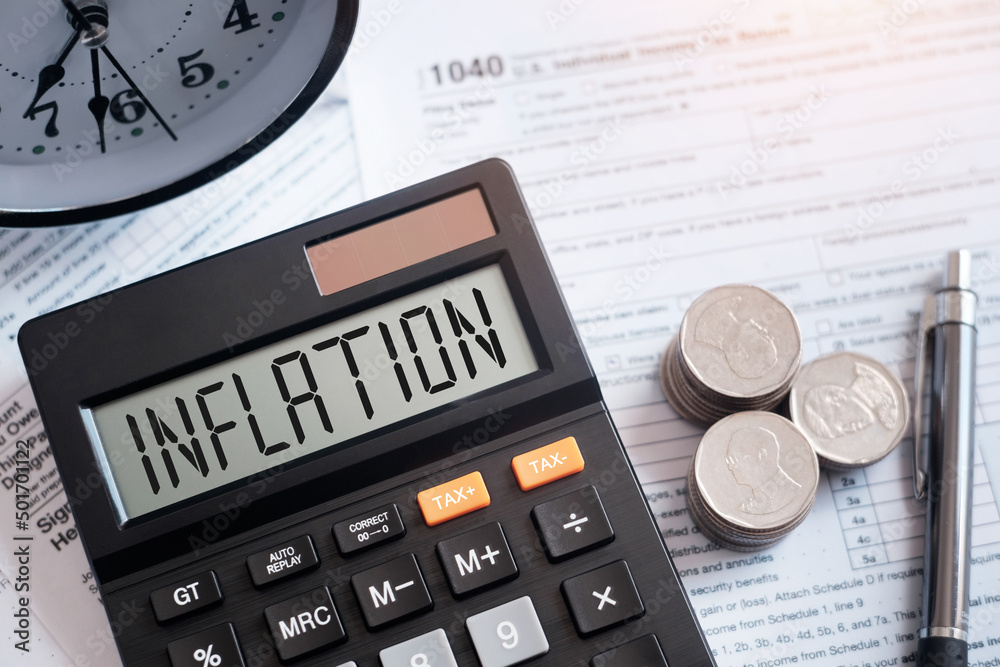Inflation word on calculator with interest rate hike consideration form Global Economics and Inflation Control US dollar inflation and the income crisis..