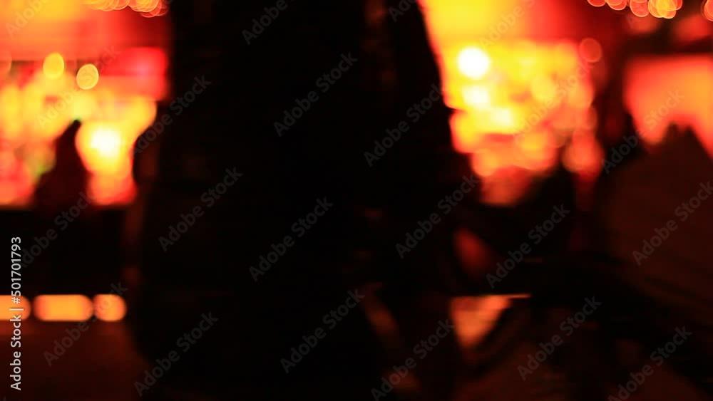 Out of focus of people, walking and shopping on night street. Holidays time. Out of focus of people, walking and shopping on night street. Holidays time.
