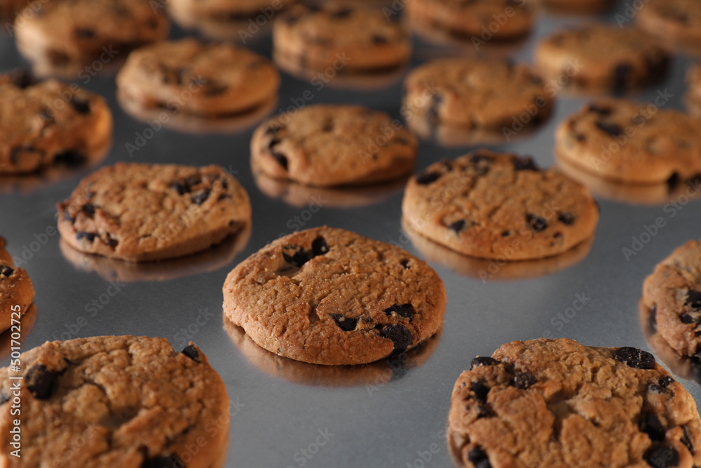 Many delicious cookies on production line, closeup Many delicious cookies on production line, closeup