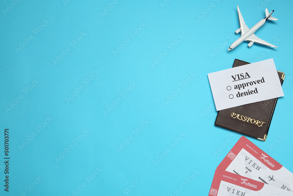 Flat lay composition with passport, toy plane and tickets on light blue background, space for text. Visa receiving Flat lay composition with passport, toy plane and tickets on light blue background, space for text. Visa receiving