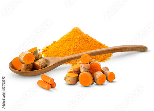 Turmeric in a wooden spoon and turmeric powder and turmeric capsule on white background.