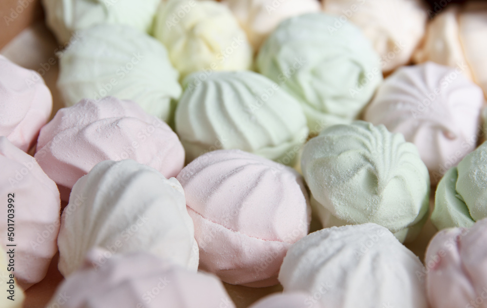 Fresh multicolored marshmallow lies in cardboard packaging prepared for sale in stores Fresh multicolored marshmallow lies in cardboard packaging prepared for sale in stores