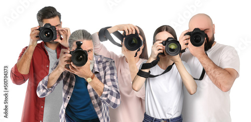 Foto Group of professional photographers with cameras on white background