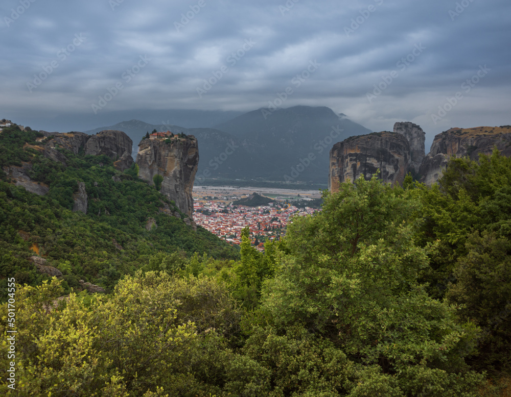 Panoramic view of Mount Meteor and the religious monastery of Greece with unusual clouds in the sky
