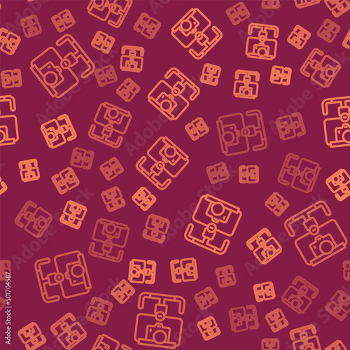 Brown line Gimbal stabilizer with DSLR camera icon isolated seamless pattern on red background. Vector