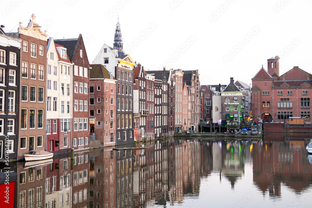 Amsterdam Holland - May 15th 2013: Amsterdam canal and famous Dutch style tall buildings
