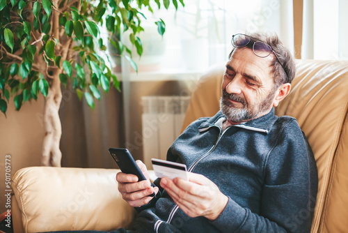 Senior man shopping online