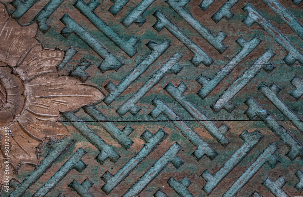 Carved wooden pattern on door background texture