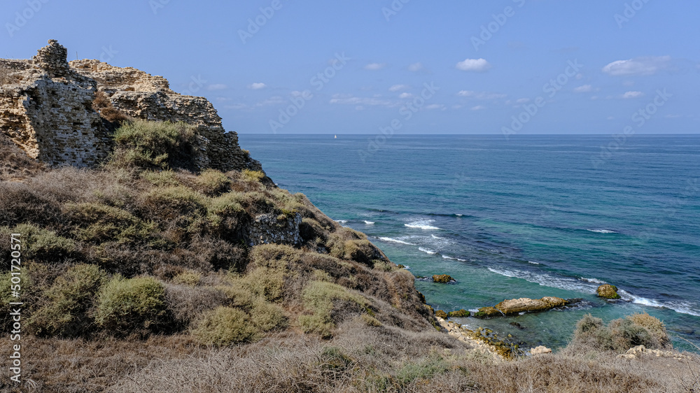 The North Face fortification wall remains of Apollonia crusader castle, located on a high kurkar sandstone cliff facing the Mediterranean seashore of Herzliya city, Apollonia National Park, Israel.