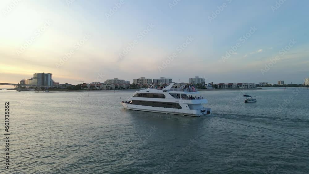 Luxury yatch sails in Clearwater beach island, Florida during sunset aerial view Luxury yatch sails in Clearwater beach island, Florida during sunset aerial view