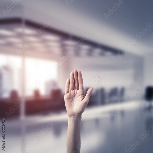 Choosing gesture of person in elegant modern interior in sunshine light