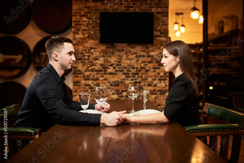 Young couple in love on a date in a restaurant..The guy and the girl are resting in a cozy place