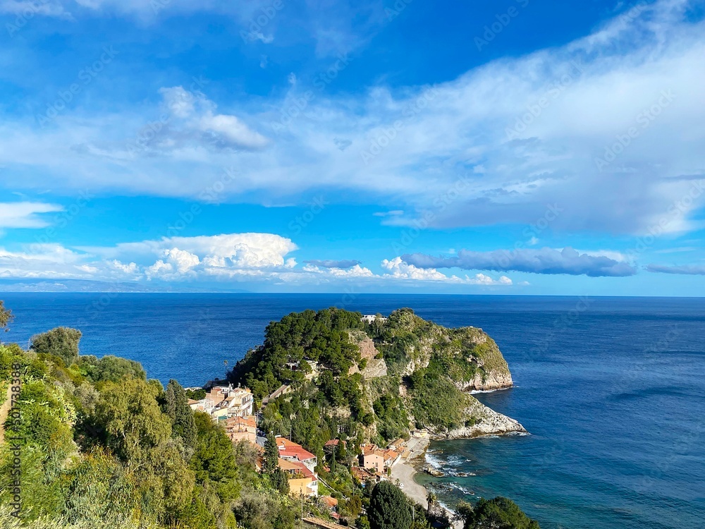 picturesque view of the Ionian Sea coast from the town of Taormina located on a hill in Sicily
