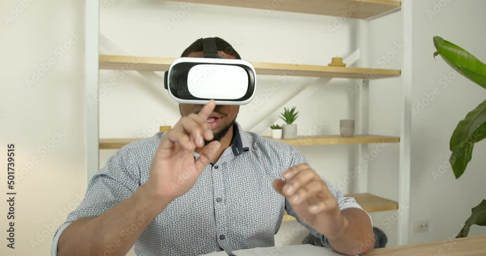 Young black man wears virtual reality glasses at office Young black man wears virtual reality glasses at office