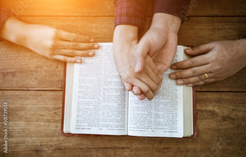Praying with hands and praying together with religious faith and belief in god on blessing background The power of hope or love and devotion.