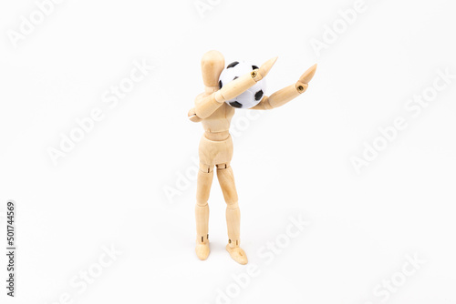 Wooden mannequin with soccer ball isolated on white background. Football player concept.
