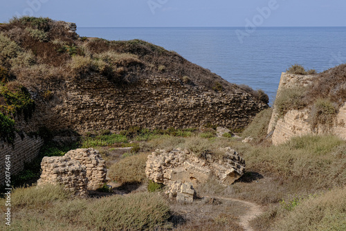 Remains of crusader's bridge over the moat of Apollonia castle, located on a high kurkar sandstone cliff facing the Mediterranean seashore of Herzliya city, Apollonia National Park, Israel.