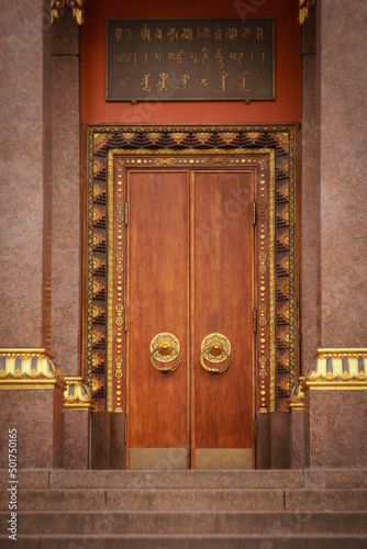 Entrance to Datsan Gunzechoinei Buddhist temple in Saint Petersburg photo