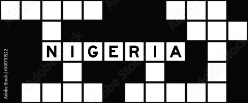 Alphabet letter in word nigeria on crossword puzzle background