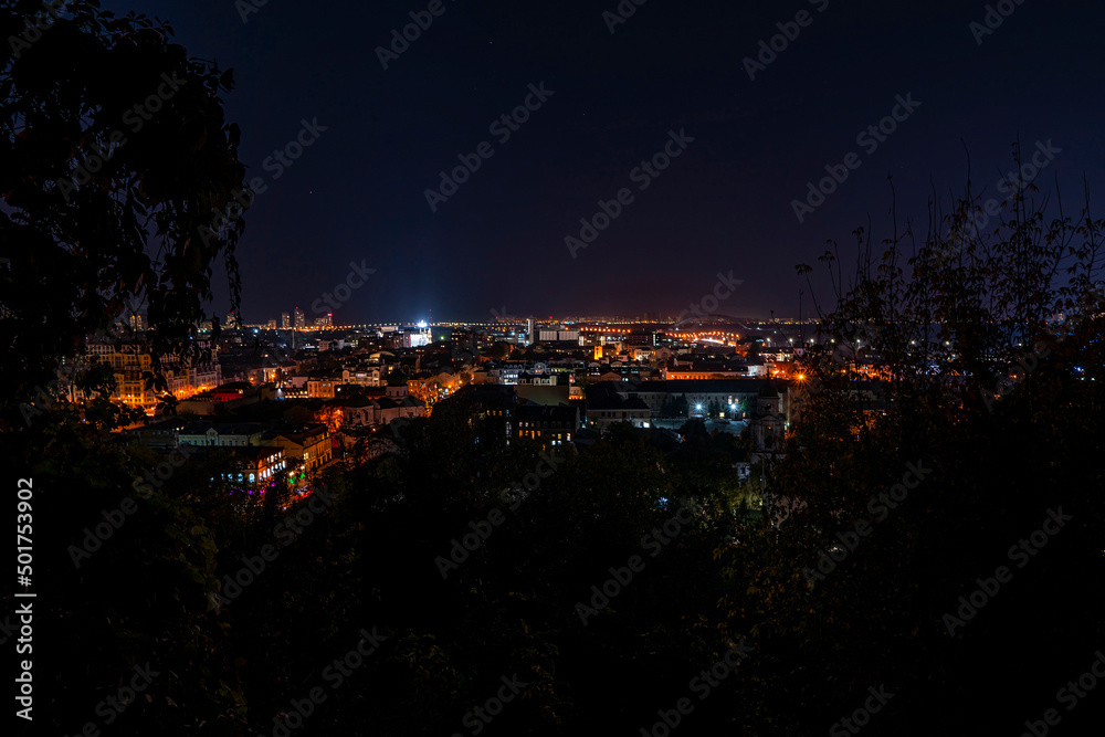 Night urban cityscape. Buildings lights of Kyiv city. Ukraine, Kiev, Podil